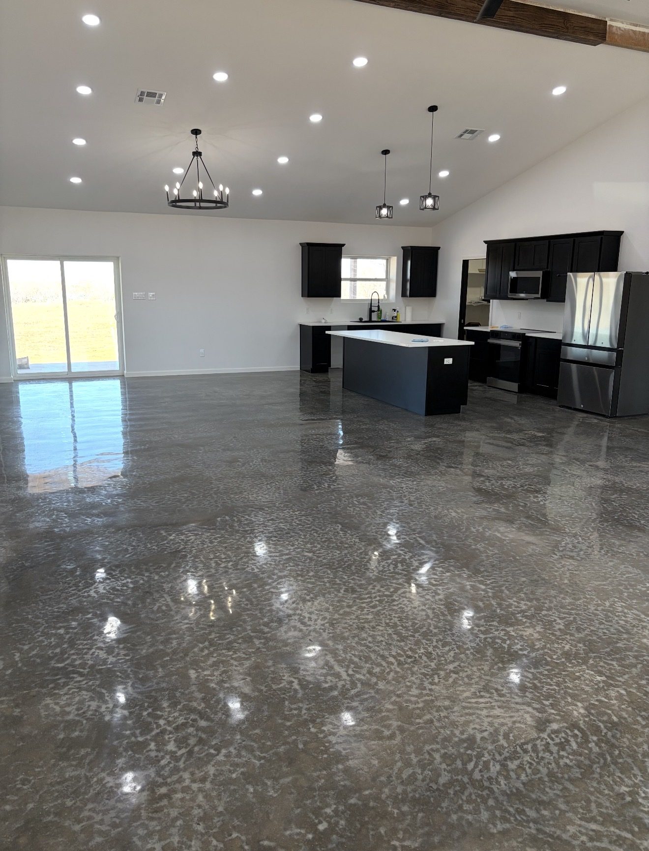 Metallic stained polished concrete floor, residential kitchen